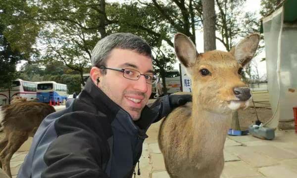 Mr. Agins next to a deer in Japan