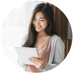 Asian female student holding tablet - Pearson Online Academy