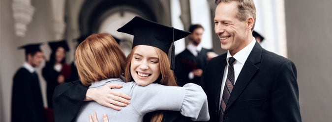 An online high school student graduating and celebrating with her family