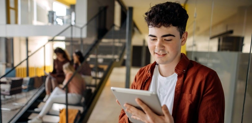 Online private high school student on his computer