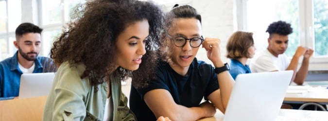 Two online private school students working on school work
