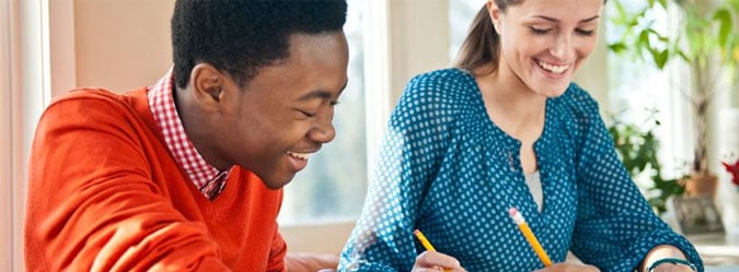 Two online private school students working on school work